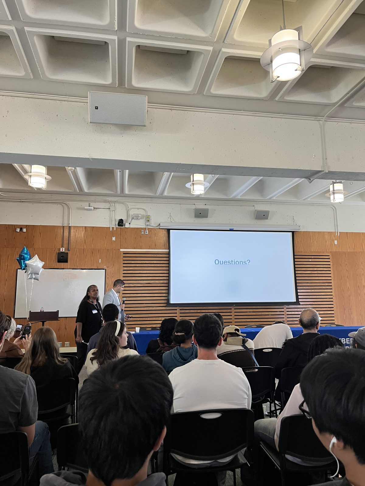 A full room of students during a talk at the job fair